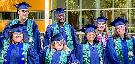 A group of young people with varying disabilities celebrate the milestone of graduation